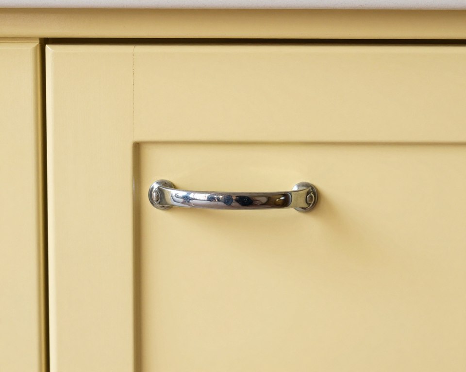 vintage yellow cabinet with chrome bin pull hardware