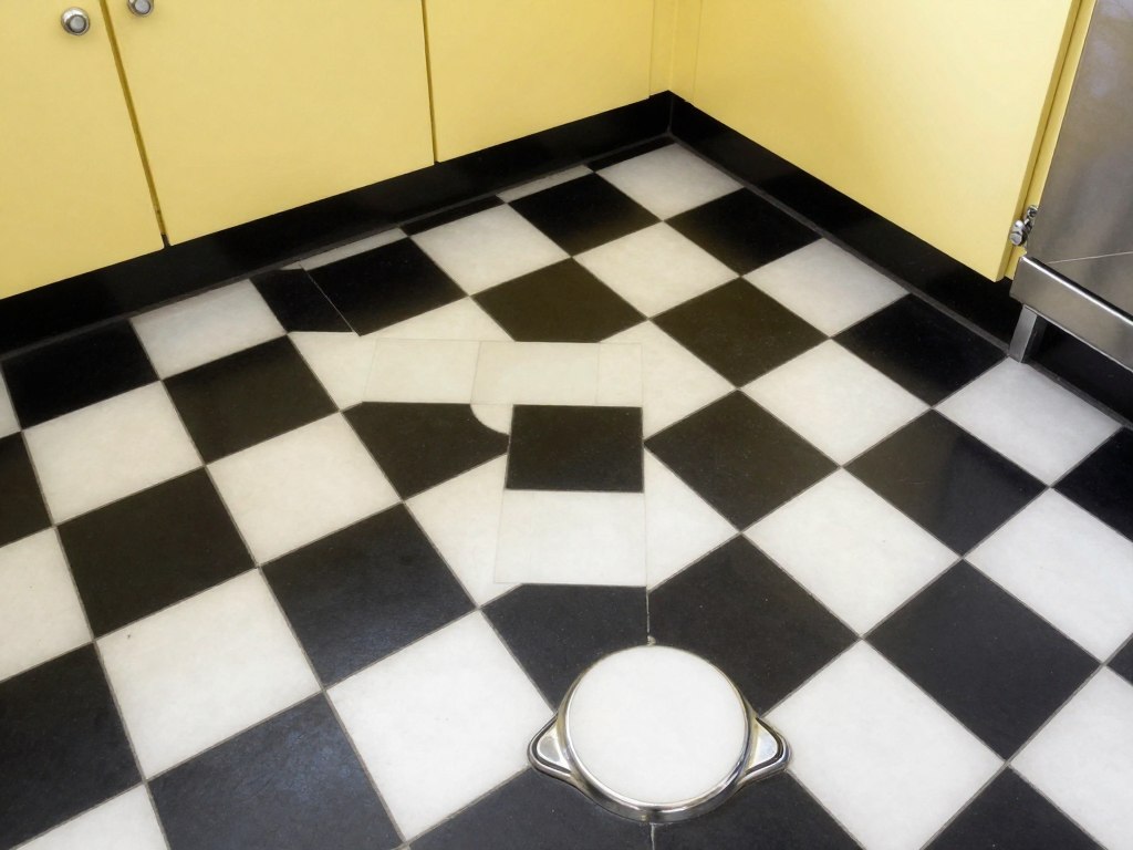 vintage yellow kitchen with black and white checkerboard floor
